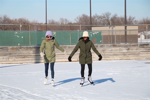 Two people ice skating at Commons Park